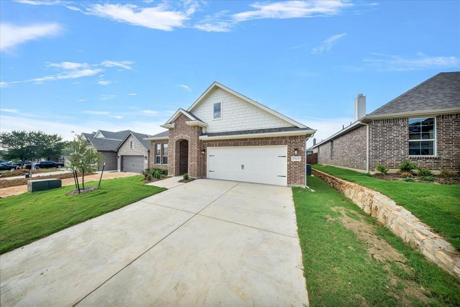 Front exterior of a new home in Liberty Pointe, Gainesville, TX, highlighting curb appeal (Image 1). Front exterior of a new home in Liberty Pointe, Gainesville, TX, highlighting curb appeal (Image 1).