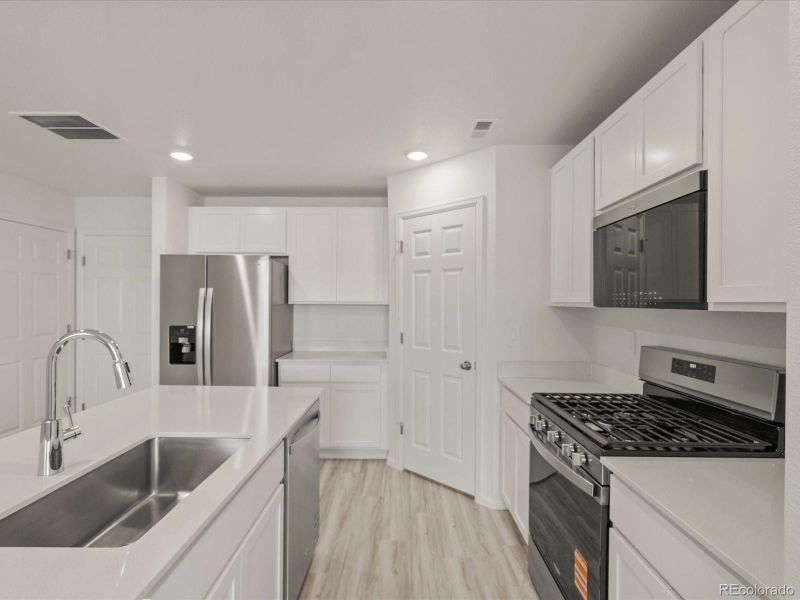 Furnished interior view inside a new home in Skyview at High Point, Aurora (Image 14).