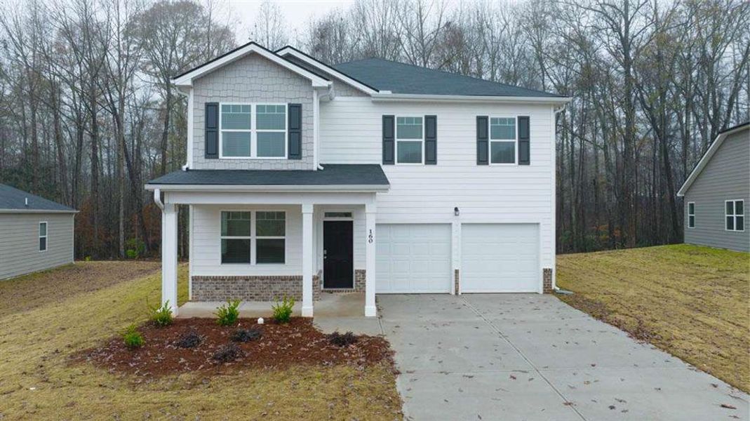 Front exterior of a new home in Oakchase at Hampton, Hampton, GA, highlighting curb appeal (Image 23).