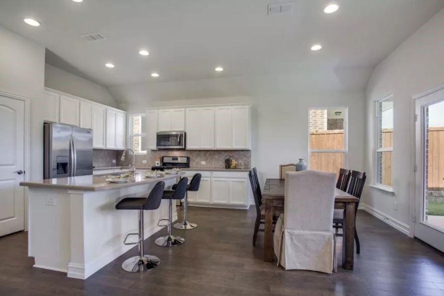 Photo of Pulte model home with same floor plan, not of actual home listed.