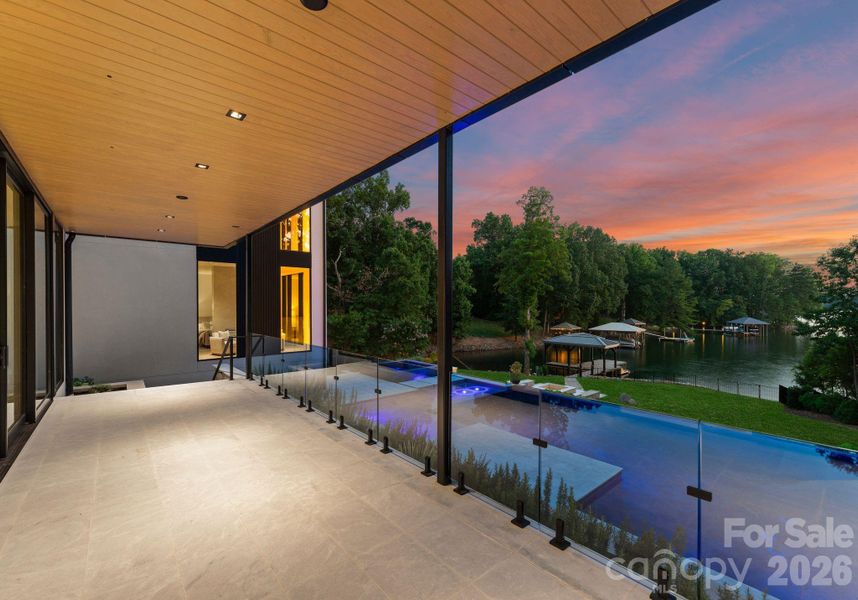 Exterior covered patio featuring outdoor kitchen and grilling area. Exterior covered patio featuring outdoor kitchen and grilling area.