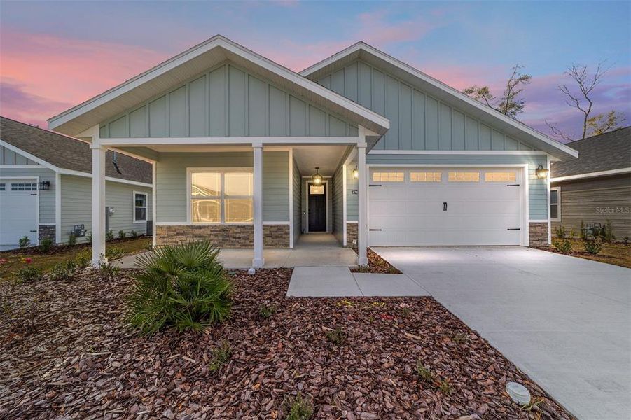 Front exterior of a new home in Grand Oaks, Gainesville, FL, highlighting curb appeal (Image 2). Front exterior of a new home in Grand Oaks, Gainesville, FL, highlighting curb appeal (Image 2).