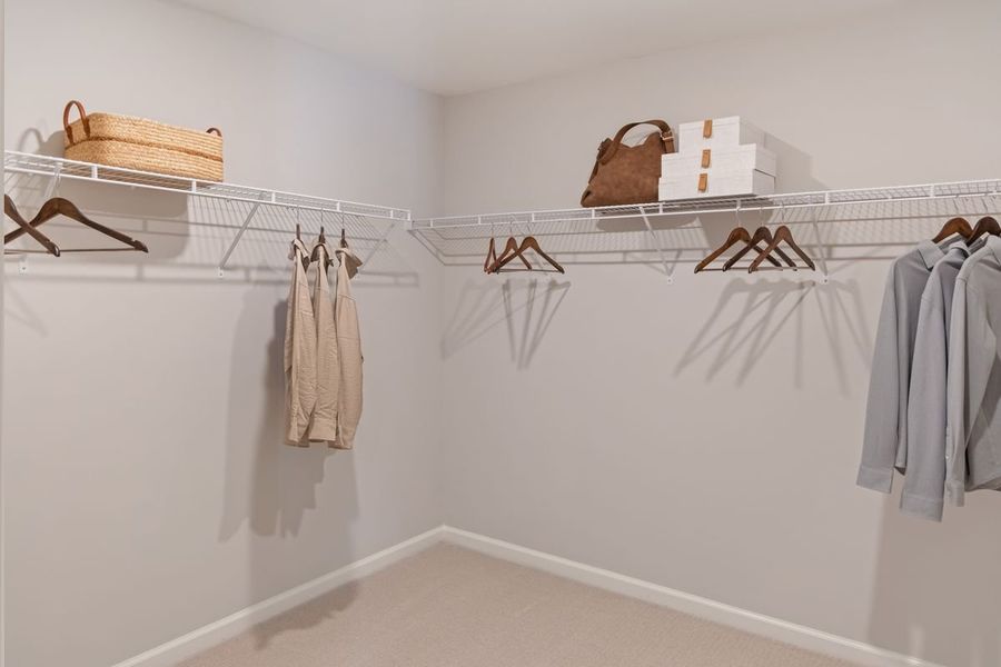 Spacious walk-in closet at primary suite
