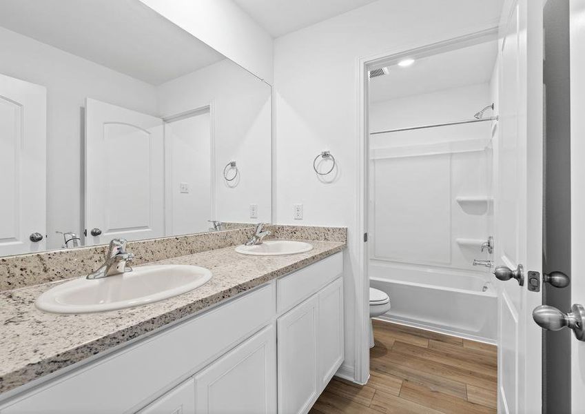 Secondary upstairs bathroom with two sinks great for the kids to share