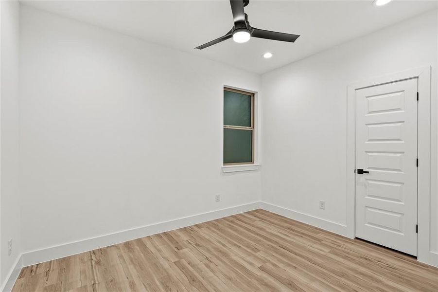 Unfurnished room featuring light hardwood / wood-style floors and ceiling fan