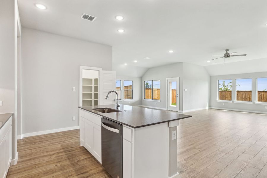Kitchen in the Bowie home plan by Trophy Signature Homes – REPRESENTATIVE PHOTO