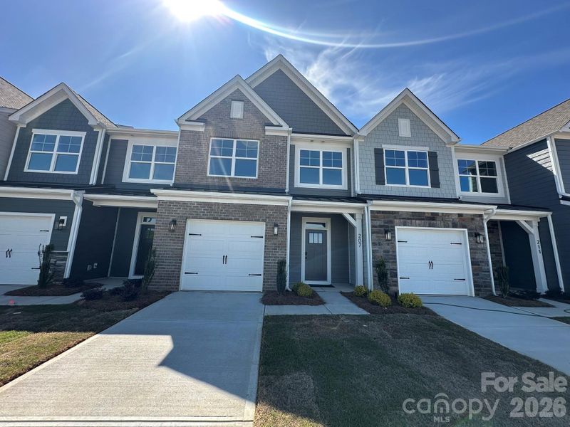 Front exterior of a new home in Blythe Mill Townhomes, Waxhaw, NC, highlighting curb appeal (Image 1). Front exterior of a new home in Blythe Mill Townhomes, Waxhaw, NC, highlighting curb appeal (Image 1).