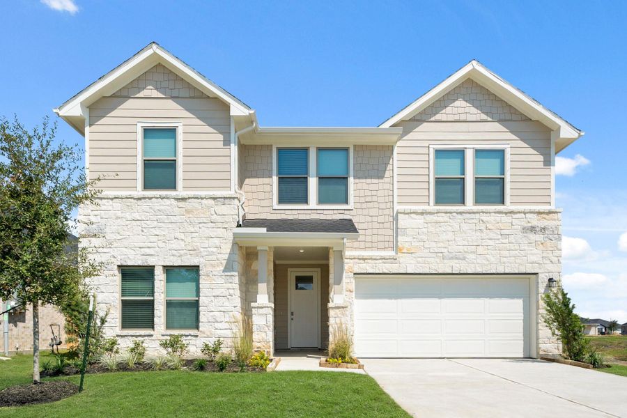 Front exterior of a new home in Laurel Landing, Alvin, TX, highlighting curb appeal (Image 14). Front exterior of a new home in Laurel Landing, Alvin, TX, highlighting curb appeal (Image 14).