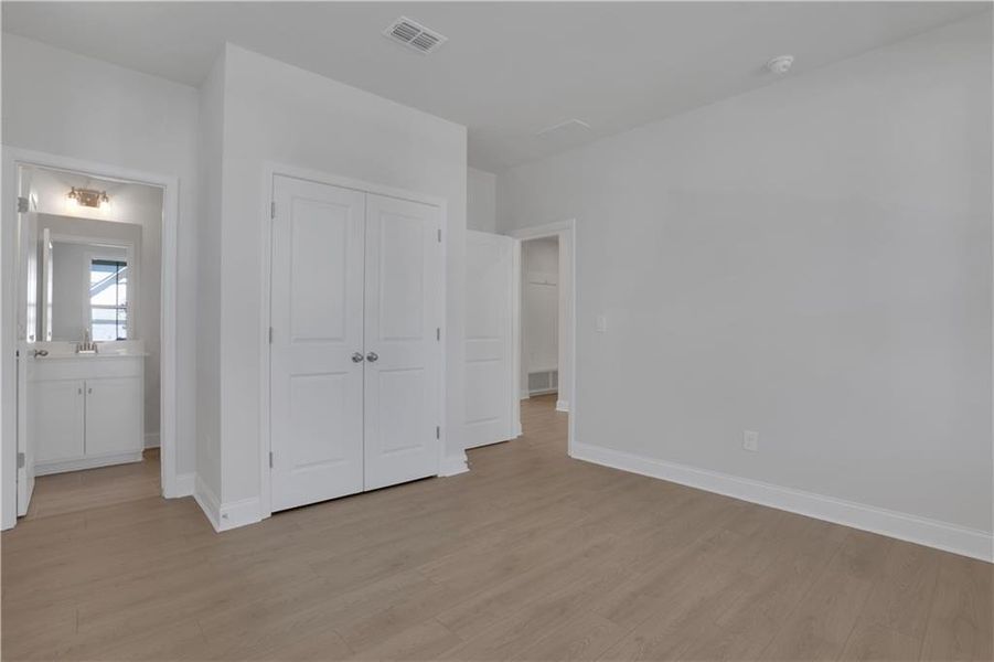 Spacious, unfurnished interior of a new home in The Paddocks at Doc Hughes, Buford (Image 22).
