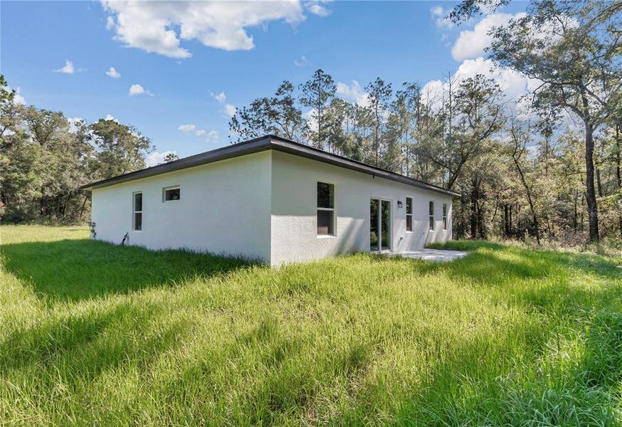 Front exterior of a new home in , Dunnellon, FL, highlighting curb appeal (Image 21).