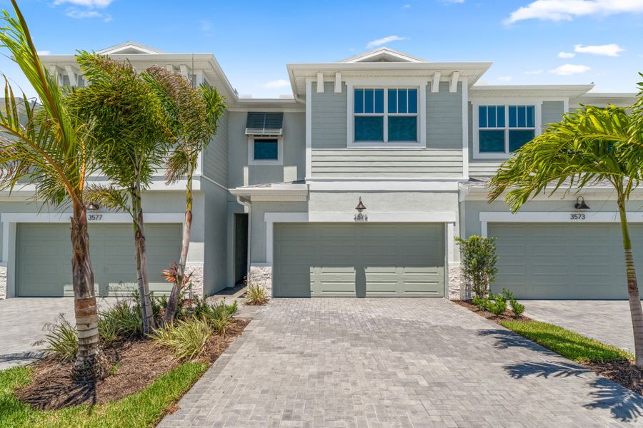 Front exterior of a new home in Avila, Jensen Beach, FL, highlighting curb appeal (Image 1). Front exterior of a new home in Avila, Jensen Beach, FL, highlighting curb appeal (Image 1).