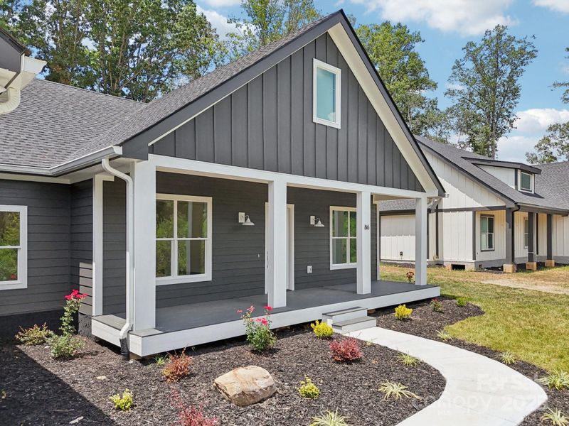 Front exterior of a new home in , Hendersonville, NC, highlighting curb appeal (Image 25).