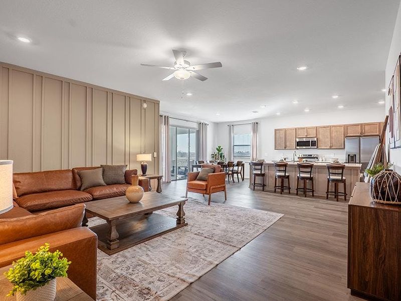 This home features a light-filled, open-concept living area - Monroe by Highland Homes This home features a light-filled, open-concept living area - Monroe by Highland Homes