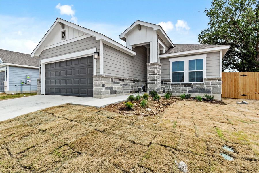 Front exterior of a new home in Butler Farms, Liberty Hill, TX, highlighting curb appeal (Image 1). Front exterior of a new home in Butler Farms, Liberty Hill, TX, highlighting curb appeal (Image 1).