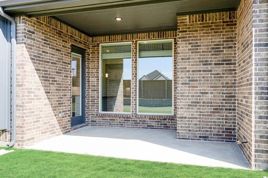 Exterior details and patio area of a home in Creekview Meadows, Pilot Point (Image 27).