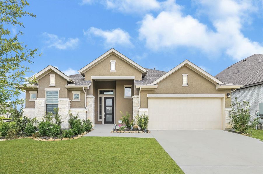 Front exterior of a new home in Lago Mar, Texas City, TX, highlighting curb appeal (Image 24). Front exterior of a new home in Lago Mar, Texas City, TX, highlighting curb appeal (Image 24).
