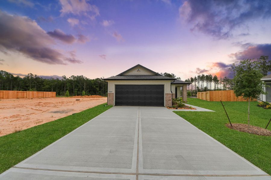 Front exterior of a new home in The Enclave at Spring Branch, Conroe, TX, highlighting curb appeal (Image 22). Front exterior of a new home in The Enclave at Spring Branch, Conroe, TX, highlighting curb appeal (Image 22).