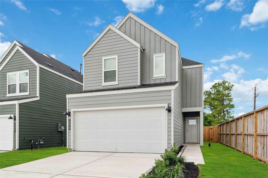 Front exterior of a new home in Legacy Village, Houston, TX, highlighting curb appeal (Image 1).