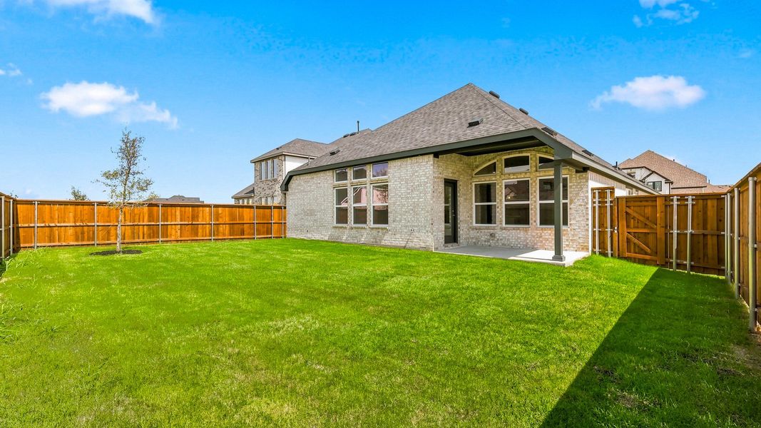 Exterior details and patio area of a home in Green Meadows Premier, Celina (Image 21).