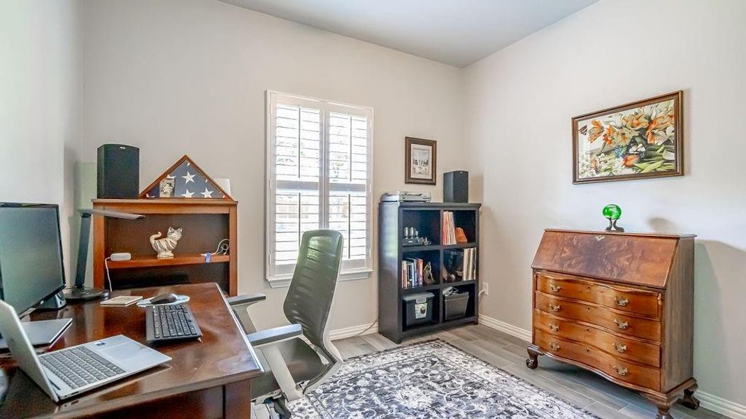 Bedroom with light hardwood / wood-style floors