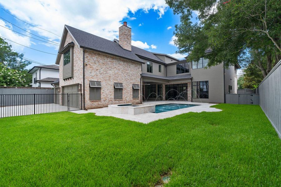 [Backyard]Beyond the pool and patio, there's plenty of grassy lawn for a play yard, if desired.