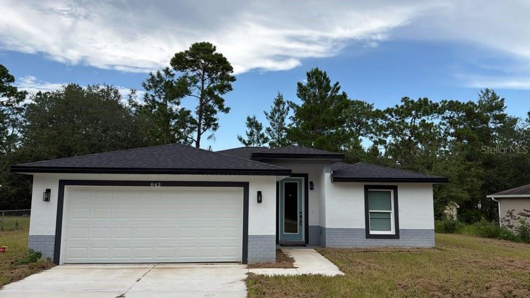 Front exterior of a new home in , Dunnellon, FL, highlighting curb appeal (Image 1). Front exterior of a new home in , Dunnellon, FL, highlighting curb appeal (Image 1).