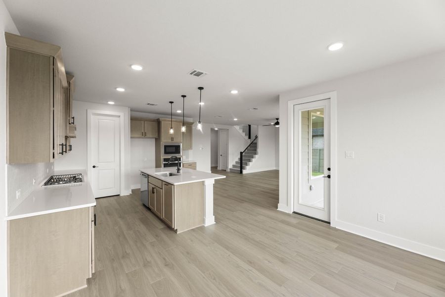 Representative furnished interior of a home built from the Magnolia by Tri Pointe Homes in Treeline, Justin (Image 6).