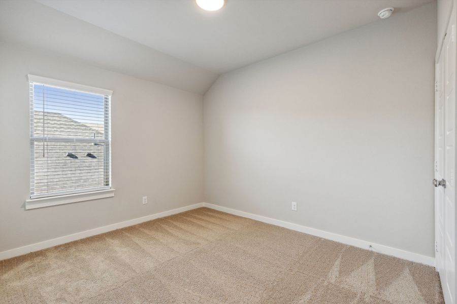 Bedroom in the Oak home plan by Trophy Signature Homes – REPRESENTATIVE PHOTO