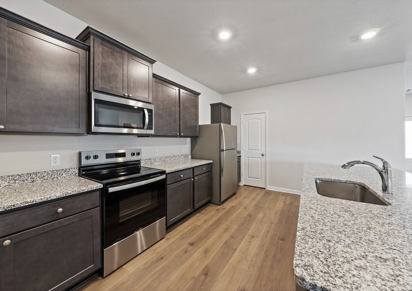 The kitchen has beautiful wood cabinetry. The kitchen has beautiful wood cabinetry.