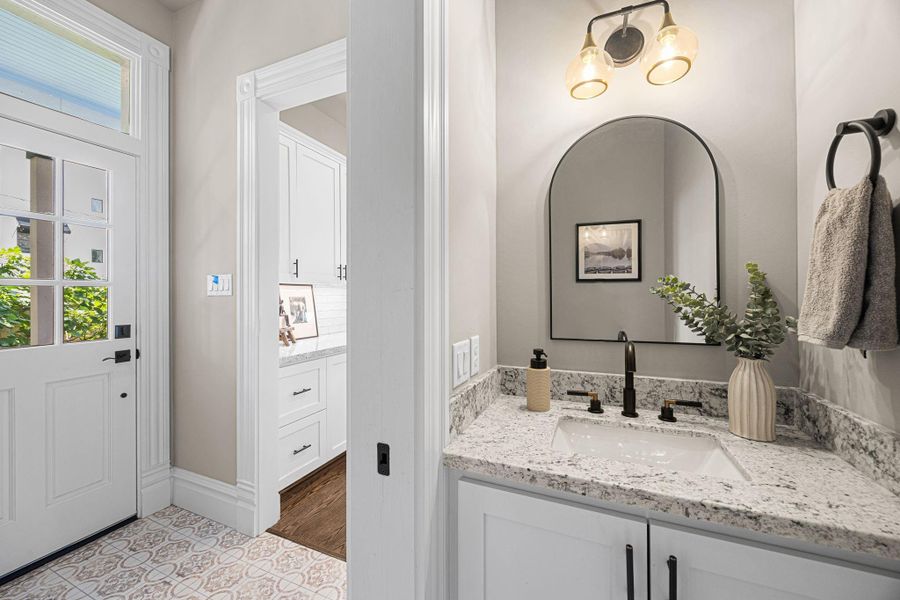 The downstairs powder bathroom offers a perfect escape away from others. The location by the back door makes this space practical for both guests as well as the eventual pool guests (once it's been added). The downstairs powder bathroom offers a perfect escape away from others. The location by the back door makes this space practical for both guests as well as the eventual pool guests (once it's been added).