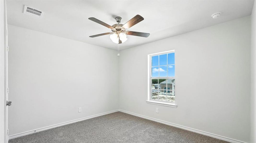 Room featuring light gray walls, gray carpet, and a white ceiling
