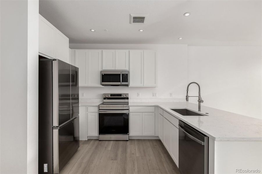 Furnished interior view inside a new home in The Scene at Sloan's Lake, Denver (Image 5).