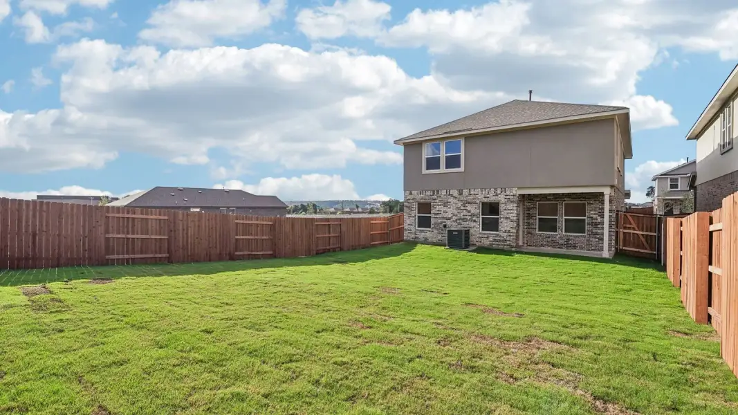 Exterior details and patio area of a home in Bar W Ranch, Leander (Image 4).