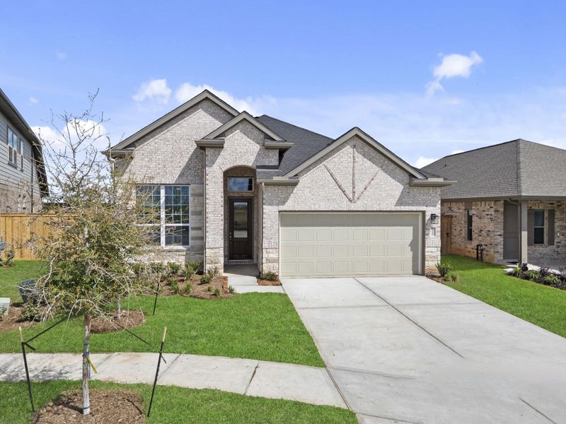 Front exterior of a new home in Beacon Point, Texas City, TX, highlighting curb appeal (Image 20).