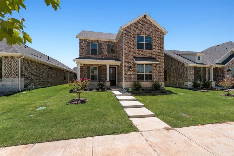 Front exterior of a new home in Arbors at Legacy Hills, Celina, TX, highlighting curb appeal (Image 2). Front exterior of a new home in Arbors at Legacy Hills, Celina, TX, highlighting curb appeal (Image 2).