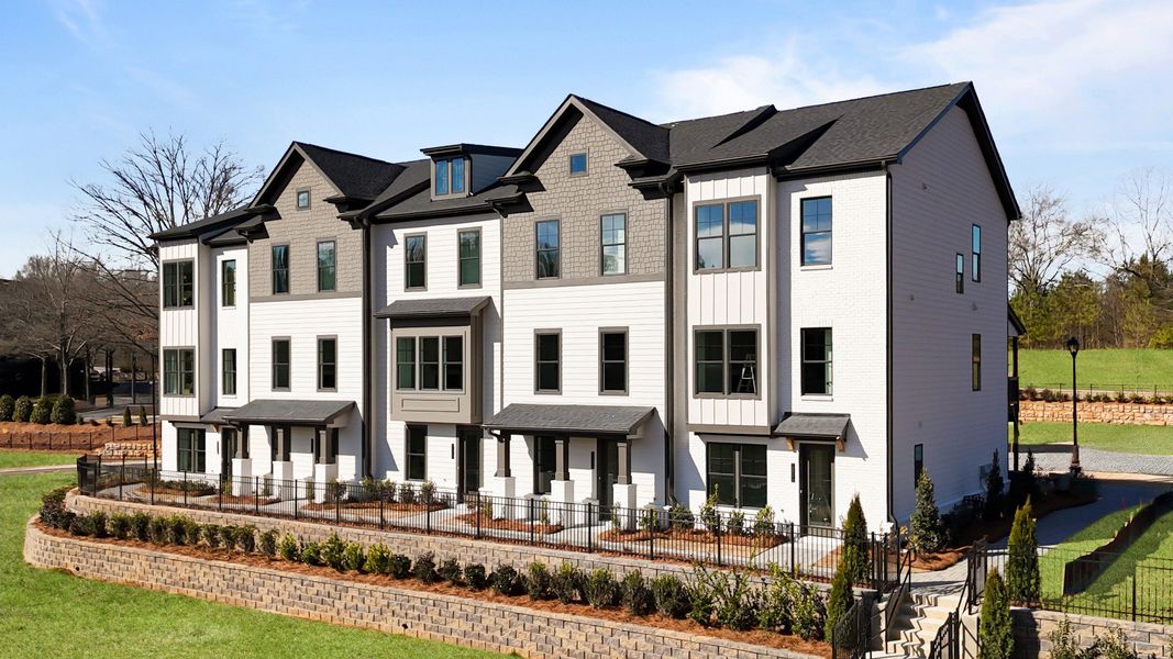 Front exterior of a new home in Barrett Pointe, Kennesaw, GA, highlighting curb appeal (Image 1). Front exterior of a new home in Barrett Pointe, Kennesaw, GA, highlighting curb appeal (Image 1).