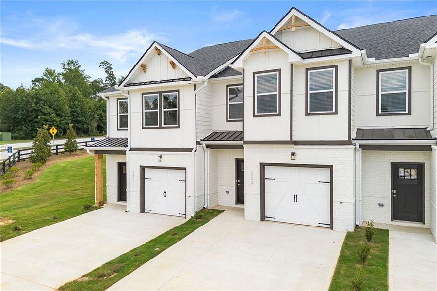 Front exterior of a new home in The Grove At Mundy Mill, Gainesville, GA, highlighting curb appeal (Image 2). Front exterior of a new home in The Grove At Mundy Mill, Gainesville, GA, highlighting curb appeal (Image 2).