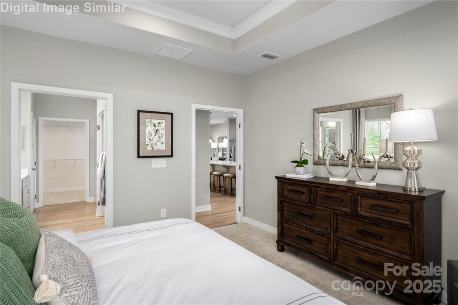 Wake up and step into luxury—your main-level primary bedroom offers direct access to a spa-inspired bath and the open-concept living space beyond. No stairs, no barriers—just seamless flow, effortless comfort, and everyday elegance. It’s the kind of layout that turns routines into rituals.