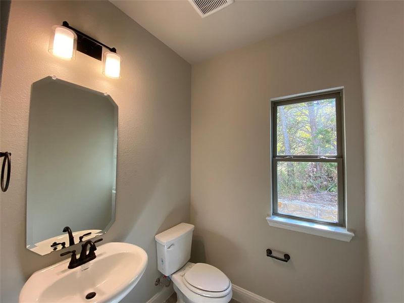 Powder bathroom with window