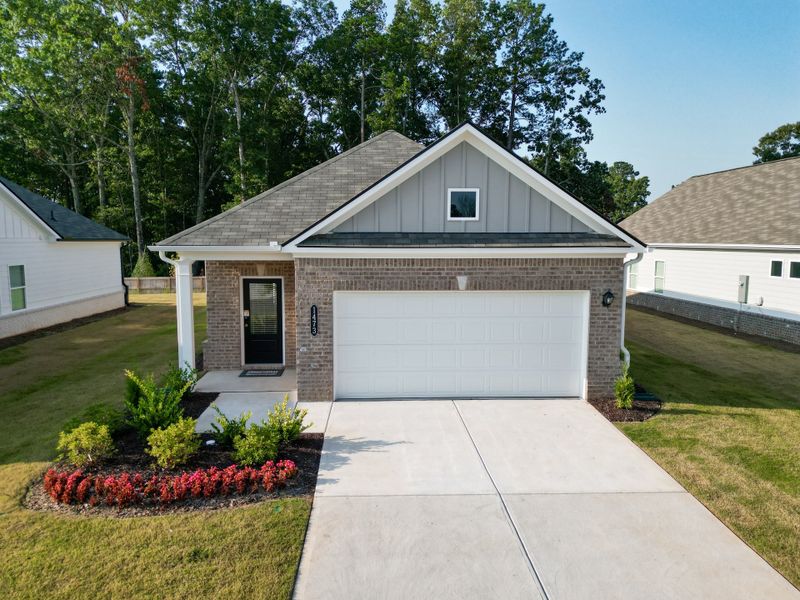 Front exterior of a new home in Trellis Park, Hampton, GA, highlighting curb appeal (Image 1).