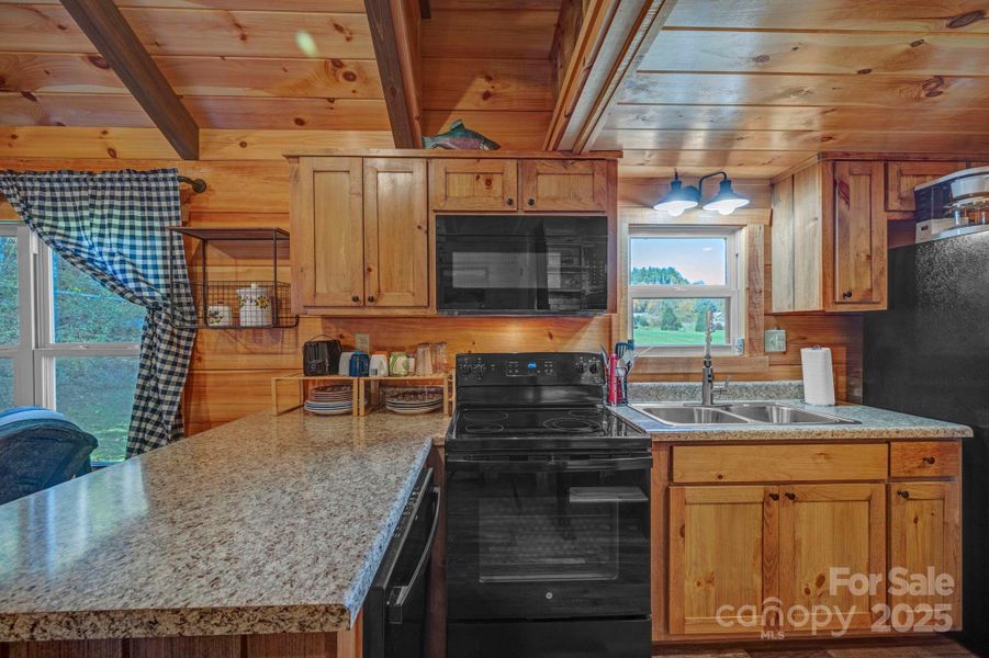 Kitchen complete with dishwasher, oven, microwave, fridge/freezer, coffee pot