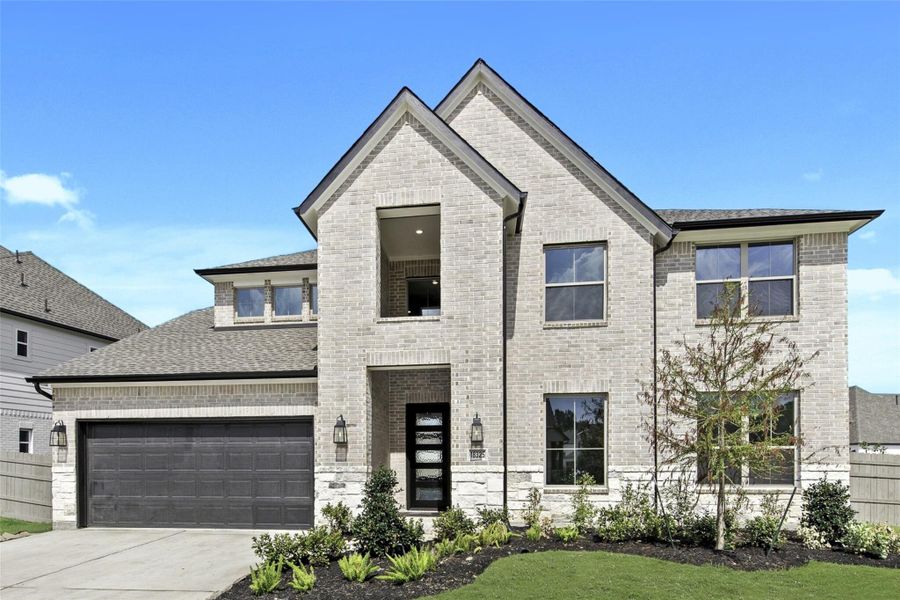 Front exterior of a new home in ARTAVIA® - 60', Conroe, TX, highlighting curb appeal (Image 2).