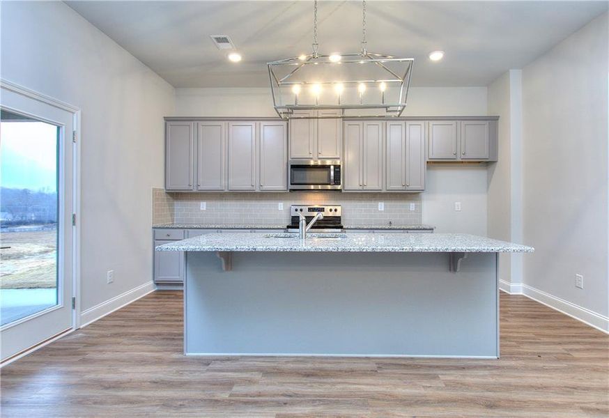 Furnished interior view inside a new home in , Homer (Image 2). Furnished interior view inside a new home in , Homer (Image 2).