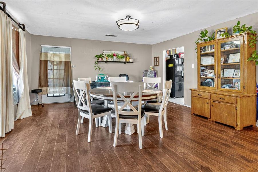Dining area featuring dark wood-style floors Dining area featuring dark wood-style floors