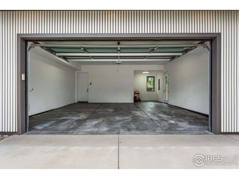 2 car garage; 656 sqft offering a work shop area, epoxy floor, and EV charger ready