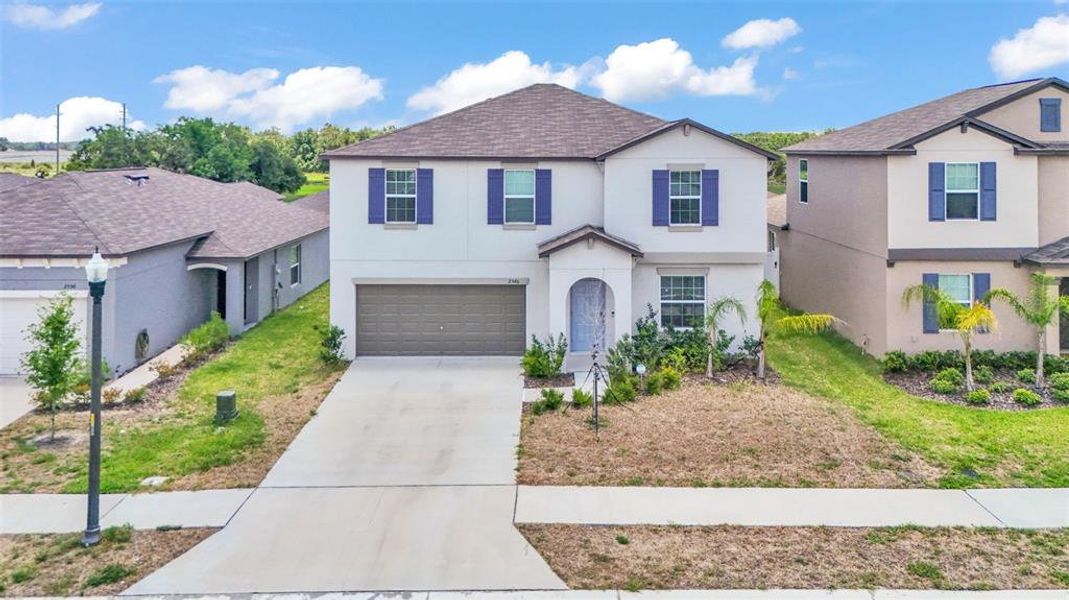 Front exterior of a new home in , Bartow, FL, highlighting curb appeal (Image 26).