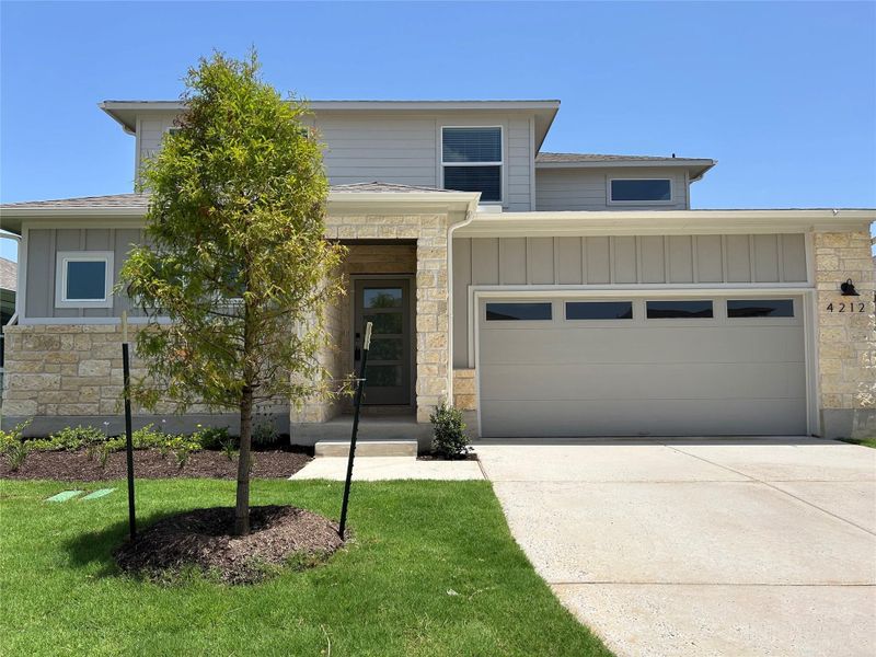 Front exterior of a new home in Lakeside Meadows, Pflugerville, TX, highlighting curb appeal (Image 8).