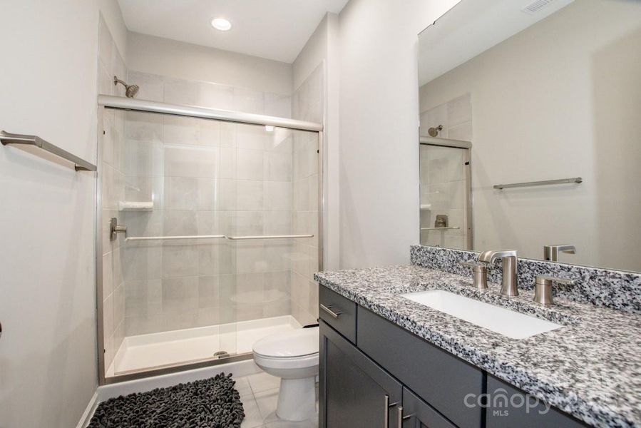 Furnished interior view inside a new home in Signature at Reid's Cove, Mooresville (Image 29).