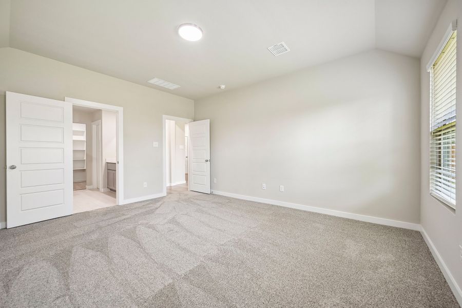 Primary Bedroom in the Harrison home plan by Trophy Signature Homes