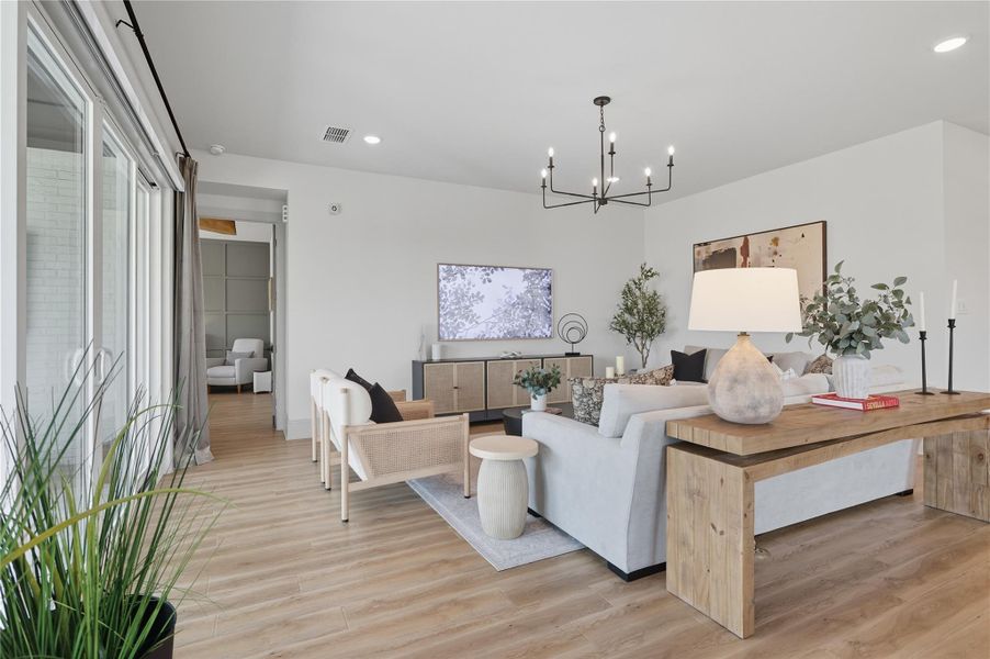 Living room connects the patio sliding doors and primary bedroom. Living room connects the patio sliding doors and primary bedroom.